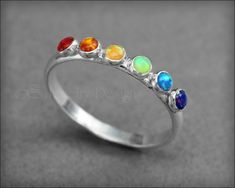 Multi Opal Ring - (choose # of opals) – LE Jewelry Designs Silver Opal Birthstone Jewelry, Silver Multi-stone Opal Ring For Promise, Adjustable Multi-stone Opal Ring For Anniversary, Spiritual Sterling Silver Multi-stone Rings, Spiritual Multi-stone Sterling Silver Rings, Unique Multi-stone Rainbow Jewelry, Rainbow Gemstone Jewelry In Sterling Silver, Rainbow Multi-stone Unique Jewelry, Sterling Silver Multi-stone Opal Promise Ring