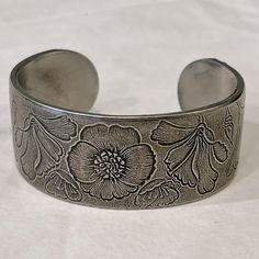 Salisbury Pewter Month Of August Wrist Cuff Bracelet. Easily Bends To Put On And Take Off And Accommodates Wrists Small And Large. Detailed With Beautiful Flowers. Diameter 2.5”, 1”W Condition: Never Worn. New Condition. Adjustable Etched Metal Cuff Bracelet, Adjustable Antique Silver Metal Cuff Bracelet, Adjustable Metal Cuff Bracelet With Stamped Detail, Adjustable Stamped Metal Cuff Bracelet, Adjustable Etched Silver Cuff Bracelet, Adjustable Silver Etched Cuff Bracelet, Adjustable Etched Cuff Bracelet For Anniversary, Vintage Silver Bracelets Hand Stamped, Adjustable Stamped Antique Silver Cuff Bracelet