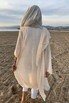 Ivory 100% Cotton Hooded Cloak. Great as a Festival or a Ceremony Clothing. This amazing long soft knit kimono with the hood is handmade from a high quality cotton knits fabric. Please note, we work with upcycled fabrics and sometimes we ran out of the particular knits and we are replacing them with the similar knit fab Mens Kimono Shirt, Desert People, Nomad Fashion, Hooded Shawl, Knit Kimono, Samurai Pants, Cotton Harem Pants, Black Harem Pants, Festival Clothes