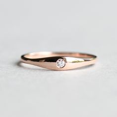 >Tapered diamond sets on 10k solid rose gold. >Solid 10k rose gold fully hallmarked. >Cut: Brilliant >2mm diamond >1.5mm band width All of our jewelry will arrive in custom packaging ready for gift giving. Custom sizes available, please message me. Other gemstones are available. LEAD TIME: Made to order will take 10-14 days. signature upon delivery, we unfortunately will not be able to reimburse or replace lost or stolen shipments. We do not accept returns on custom orders. Please 14k Rose Gold Stackable Promise Rings, 14k Rose Gold Stackable Rings With Brilliant Cut, Rose Gold Single Diamond Promise Ring, Dainty 14k Rose Gold Diamond Ring For Anniversary, Minimalist Rose Gold Diamond Wedding Ring, 14k Rose Gold Diamond Ring For Promise, 14k Rose Gold Diamond Ring With Accents As Gift, Rose Gold 14k Gold Single Diamond Wedding Ring, Rose Gold Diamond Ring As Gift