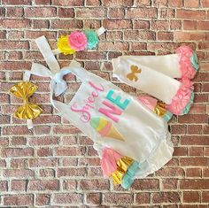 "This adorable romper is perfect for your princess' 1st birthday outfit. It makes a great photo prop for her birthday pictures, birthday invitations or just to remember this special day!! The romper has straps that untie so you can lower or raise the outfit for a better fit. The back of the romper has layers of ruffle and the top of the ruffles is embellished with a gold bow. If you would like a different color bow, please message me with the color that you would like. HEADBANDS- The headband is Fitted Sets For Birthday And Summer, Fitted Sets For Birthday In Summer, Fitted Sets For Summer Birthday, Cute Fitted Bubble Romper For Birthday, Fun White Sets For Birthday, Cute Bubble Romper For Spring Party, Fun White Birthday Sets, Fun White Dresses For Birthday, Cute Spring Party Bubble Romper