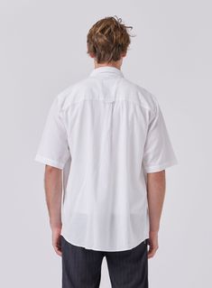 The Crepe Shirt in White is designed to be your next trans-seasonal wardrobe staple constructed from 100% Cotton crepe. Layer it up over a tee or tank for a more casual look and button it up when the formalities kick in. Classic Collar Double Chest Pockets Oversized Fit Relaxed Fit Button-up Short Sleeve Shirt For Casual Gatherings, Relaxed Fit Short Sleeve Button-up Shirt For Casual Gatherings, White Button-up Shirt For Casual Gatherings, White Unstructured Casual Camp Shirt, Casual Unstructured Tops With Shirttail Hem, Relaxed Fit Shirt With Camp Collar For Casual Gatherings, Classic Tops With Rolled Sleeves In Relaxed Fit, Classic Button-up Camp Shirt For Casual Gatherings, Classic Shirt With Camp Collar For Casual Gatherings