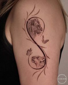 a woman's shoulder with a lion and butterfly tattoo on the left side of her arm