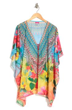 A breezy and lightweight poncho in a blooming floral print brings effortless boho vibes to your wardrobe. 31'' length (O/S) V-neck with lace-up closure Kimono sleeves All-over print Woven 100% polyester Dry clean Imported Model stats: 5'10", 32" bust, 25" waist, 36" hip. Model is wearing size OS. Bohemian V-neck Kaftan For Spring, Bohemian Multicolor Tunic Cover-up, Free Size Kaftan For Spring Beach Cover-up, Casual Multicolor Boho Print Cover-up, Bohemian Multicolor Printed Cover-up, Bohemian V-neck Cover-up With Floral Print, Bohemian V-neck Floral Print Cover-up, Flowy Bohemian Poncho For Beach Cover-up, Spring Floral Print V-neck Kaftan