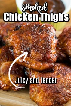 grilled chicken thighs on a cutting board with text overlay that reads smoked chicken thighs juicy and tender