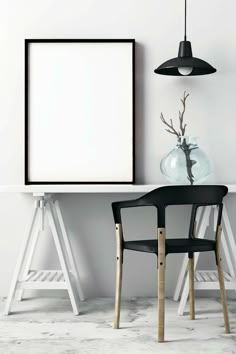 two chairs and a table with a vase on it next to an empty poster frame