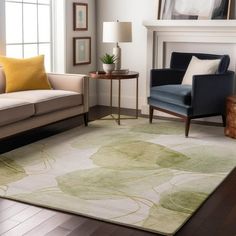 a living room with two couches and a rug on the floor in front of a fireplace