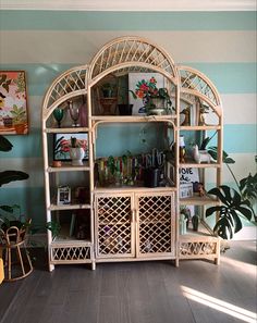 a living room filled with furniture and plants