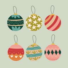 christmas ornaments hanging from strings on a green background