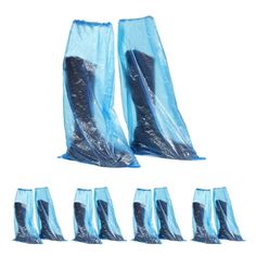 blue plastic bags are lined up on top of each other