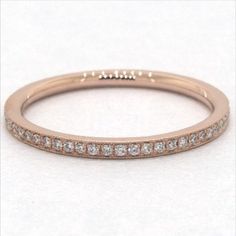 Crafted in 14K rose gold, this single row diamond band with delicate milgrain detail is chic and timeless. Wear this simply beautiful band on its own or stack with other rings for a fashion forward look. James Allen Ring Style: 81128R14 #weddingrings #weddingring #engagementrings #engagementring #marryme #proposal #isaidyes #dreamwedding #propose #showmeyourrings #theknotrings #heputaringonit #imengaged #ido #diamondring #stackablerings #jamesallen #jamesallenrings #eternityband Luxury Stackable Rings With Single Cut Diamonds, Stackable Diamond Rose Gold Eternity Band, Rose Gold Diamond Band In Fine Jewelry Style, Rose Gold Half Eternity Stackable Rings, Rose Gold Stackable Eternity Band, Rose Gold Half Eternity Band Fine Jewelry, Rose Gold Diamond Round Cut Bands, Classic Stackable Rose Gold Diamond Ring, Rose Gold Diamond Stackable Rings, Round Band