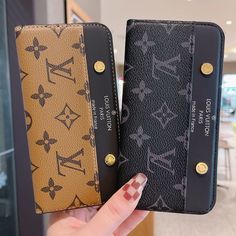 two women's wallets are being held up in front of each other,