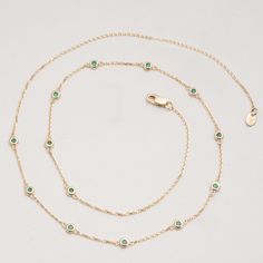 Gwen Timelessly beautiful, glistening Emeralds appear to float on your neck, with refined elegance. You will immediately feel like royalty! The classic station necklace will be your go-to, and truly never goes out of style as it just enhances your natural beauty. Also, it’s such an easy style to layer with other dainty necklaces. May’s birthstone, this stunning necklace will be the perfect gift for a woman of any age! - Handmade- Solid Gold- Natural Emerald- Bezel Size: 3 mm- Space Between the B Dainty Necklaces, Handmade Fine Jewelry, Easy Style, Station Necklace, Stunning Necklace, Shopping Websites, Rose Gold Necklace, Gold Set, Natural Emerald