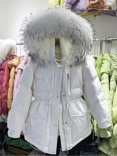 Winter White Hooded Jacket With Detachable Hood For Fall, Fall Hooded Jacket With Detachable Hood In Winter White, Hooded Winter White Puffer Jacket, Winter White Parka For Cold Weather, Winter White Parka With Double-lined Hood, Winter White Parka With Pockets, Winter White Long Sleeve Parka With Pockets, Hooded Winter White Parka With Pockets, Winter White Hooded Parka With Pockets