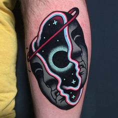 a person with a tattoo on their arm that has an image of a skull in the middle