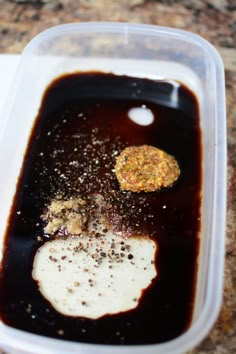 a plastic container filled with food on top of a table