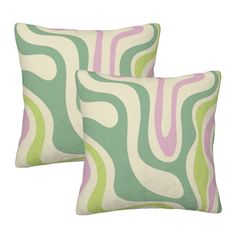 two green and pink pillows sitting next to each other