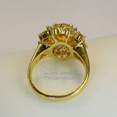 Thank you for coming in! This Vintage Ring has a strong striking yellow sapphire as its center piece. The sapphire is bezel set into a fancy setting with 8 heart and 8 round diamonds totaling 1.8 carats! Ring Size: 7.75 Total Weight: 9.58 grams Precious Metal: 18k solid gold Precious stones: -Yellow Sapphire: 2.92 carats, 9mm x 7.3mm -White Round Diamonds: 1.8 ct Hallmark: A18K Gold Ring Vintage, Platinum Diamond Rings, Solid Gold Ring, Brooch Bouquets, Solid Gold Rings, Platinum Ring, Aquamarine Blue, Precious Metal, Yellow Sapphire