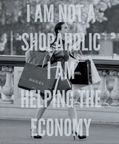 a woman walking down the street with shopping bags in her hand and words on it that say i am not a shopaholici i am helping the economy economy