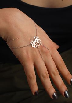 Sterling Silver Hand Chain Bracelet, Lotus Flower Bracelet, Layering Bracelet, Minimalist Flower Bracelet, Yoga Jewelry, Dainty Bracelet ♡ PRODUCT FEATURES  The Silver Bracelet is our own design and is meticulously and carefully prepared in our workshop. The perfect gift for yourself and your loved ones. - Material: 925 sterling silver - Bracelet height: 2 cm - Bracelet width: 1.9 cm - Color Options: Silver, Yellow Gold, Rose Gold ♡ PACKAGING - All orders come in our high-quality designed wooden Minimalist Adjustable Flower Jewelry, Minimalist Adjustable Jewelry With Flower Charm, Minimalist Adjustable Flower Charm Jewelry, Trendy Silver Flower Bracelets, Dainty Silver Flower Bracelets, Dainty Adjustable Flower Chain Bracelet, Delicate Silver Flower Bracelets, Elegant Sterling Silver Flower Bracelets, Elegant Silver Flower-shaped Bracelets