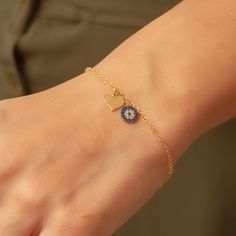 "This beautiful 14K Gold bracelet has an evil eye charm and a heart charm with a 14K gold chain. Dainty Evil Eye with Heart Charm Protection Bracelet is a Great Gift For Her. We ship our products by Express shipping free to the USA, Europe, the UK and most of the world. Most of our shipment to the USA, Europe and the UK has been delivered in 2 days. In general, it takes 2-5 business days to deliver all around the world. . Material: Solid real Gold (not gold filled or gold plated) Gold Karat: 14k Gold Heart-shaped Evil Eye Jewelry, Heart-shaped Gold Evil Eye Jewelry, Gold Heart Evil Eye Jewelry, Blue Heart-shaped Gold Plated Jewelry, Blue Heart-shaped Gold-plated Jewelry, Blue Heart Charm Bracelet As A Gift, Blue Heart Charm Bracelet For Gift, Heart-shaped Blue Charm Bracelet For Gift, Blue Heart Charm Bracelet Gift