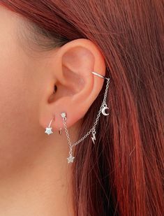 "Look stunning with this CZ stud earring and ear cuff with a delicate chain with charms. It is made of 925 Sterling Silver and 18K Gold plated. It has three charms: a moon, a lightning bolt, and a star with cubic zirconias in pavé setting to give a sparkly look. This earring is only for the left ear. This minimalist and chic earring is a great gift idea. 👉🏼Features: ♥ This earring requires 1 earlobe piercing. ♥ This ear cuff is only for the left ear. ♥ Suitable for sensitive skin. Hypoallergen Silver Dangle Ear Cuff With Matching Earrings, Sterling Silver Dangle Ear Cuff For Party, Dainty Dangle Pierced Ear Cuff, Dainty Dangle Ear Cuff, Trendy Dangle Ear Climbers As Gift, Trendy Pierced Dangle Ear Cuff, Dainty Dangle Ear Cuff For Pierced Ears, Party Dangle Ear Cuff With Adjustable Chain, Dainty Dangle Single Ear Cuff