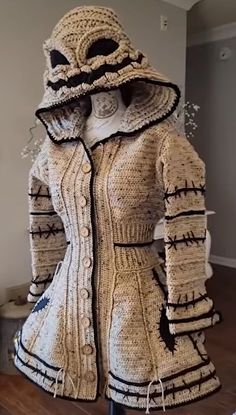 a mannequin wearing a jacket made out of knitted material