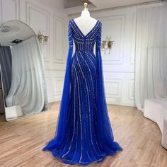 a blue evening gown on display in a room