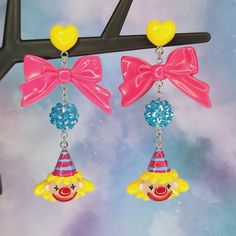 Bright and colorful party hat clown earrings - Halloween earrings - Circus jewelry - carnival - Lolitafashion earrings - post dangle earrings The perfect earrings for clowning around! Makes a great gift idea as well. Both wide plastic and silicone rubber backings included for comfort (pictured with plastic backings) **Stainless steel earring posts are hypoallergenic and nickel free Made of resin / plastic Charms are one sided and flat on the back Earring length is: 3 1/4" (in) Earring width is: Yellow Fun Earrings For Party, Adjustable Fun Party Earrings, Yellow Novelty Jewelry For Party, Cute Halloween Party Jewelry, Fun Dangle Earrings For Party, Fun Adjustable Earrings For Birthday, Playful Multicolor Earrings For Birthday, Pink Novelty Earrings For Party, Pink Plastic Earrings For Party