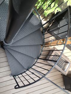 an overhead view of a spiral staircase on a deck