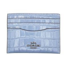 The Coach Women's Small Slim Leather ID Card Case is crafted from croc-embossed leather, offering a stylish and functional design. It features an ID window, 3 credit card slots, and an open middle compartment for quick access to your essentials. With its slim profile, this card case is perfect for slipping into any bag or pocket for everyday use. Color: Blue.  Gender: female.  Age Group: adult. Luxury Coach Card Holder With Card Slots, Formal Coach Card Holder, Elegant Coach Card Holder With Card Slots, Luxury Coach Wallets With Card Slots, Elegant Coach Leather Card Holder, Blue Coach Wallets With Card Slots, Blue Leather Coach Wallet, Elegant Blue Coach Wallet, Cornflower Blue