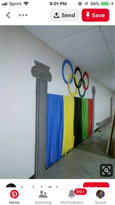 the olympic rings are hanging on the wall