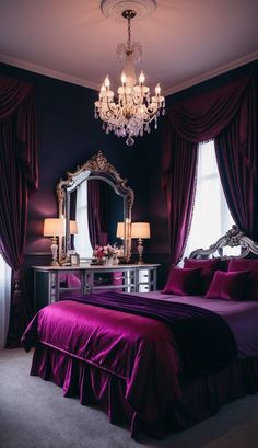 a bedroom with purple bedding, chandelier and large mirror on the wall