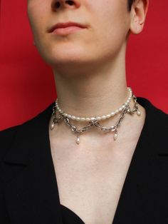 ON ME: - Total strand length is 13" All sizes: 13 inch - 33 cm 15 inch - 38 cm 17 inch - 43 cm Welcome to a stunning statement pearl choker delicately adorned with a silver chain, a perfect blend of sophistication and elegance. Explore the captivating allure of our drop pearl choker collars, designed to make a statement with every wear. Celebrate the timeless beauty of pearls with our classic freshwater pearl necklaces and pearl drop necklaces, each meticulously crafted to enhance your ensemble Silver Pearl Choker, Drop Necklaces, Classic Pearl Necklace, Prom Necklaces, Pearl Drop Necklace, Pearl Chain Necklace, Pearl Necklaces, Choker Collar, Pearl Choker