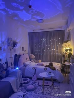 a bedroom with blue lights on the ceiling