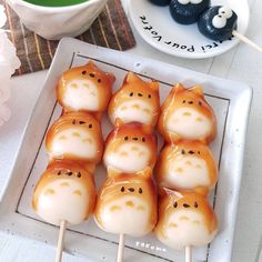 there are many marshmallows with cats on them