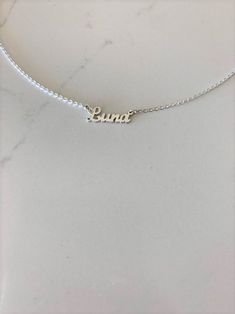 "Dainty Personalized Name Necklace 925 Sterling Silver * Custom Gold Name Necklace * Cursive, Tiny, Dainty Name Necklace * Silver Nameplate Necklace -------------------------------------------------- ♦ -------------------------------------------------- The beautiful personalized necklace, is dainty and in style. It can be worn everyday even in the shower. If you are looking for a gift for a dear loved one, think of this necklace - we can help you get it in time for any special event. ♦ Materials Silver Nameplate Necklace, Couple Initial Necklace, Location Necklace, Celebrity Necklace, Nameplate Necklace Silver, Poppy Necklace, Coordinates Jewelry, Custom Bar Necklace, Sideways Initial Necklace