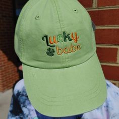 Hats Will Always Have The Same Color Threads - Dark Green 1126, Light Green 1121, Gold 1187, Light Orange 1190 - Unless Otherwise Requested! Please Choose A Cap Color! Add text to the back of your cap: https://www.etsy.com/listing/512387337/back-of-cap-text-add-on?ga_search_query=cap+back&ref=shop_items_search_1 Standard shipping arrives via USPS First Class Mail and typically arrives within 4-5 days of shipment. Want to upgrade your shipping to priority?: https://www.etsy.com/listing/528855379/ Trendy Green Hat With Embroidered Logo, Trendy Green Visor Hat, Green Hat With Embroidered Logo For Baseball Season, Green Hat With Embroidered Logo For Baseball, Green Hat With Letter Print And Curved Bill, Green Visor Hat With Embroidered Logo, Green Curved Bill Hat With Letter Print, Green Embroidered Logo Visor Hat, Green Hat With Embroidered Logo And Curved Brim