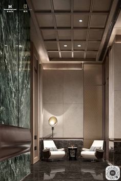 an elegant living room with marble floors and walls, along with two white lounge chairs