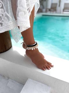 This exquisite Boho Cowrie Shell Ankle Bracelet is a summer essential for those who love a touch of the ocean in their style. Handcrafted meticulously, this anklet features authentic cowrie shells, symbolizing protection and strength, paired with fine beads that enhance its aesthetic appeal. Perfect for beach days or a casual sunny outing, this ankle bracelet embraces the spirit of summer with its natural, bohemian vibe. Its adjustable design ensures it fits comfortably around any ankle, making Bohemian Toe Ring Jewelry For Beach, Bohemian Anklets As Summer Gift, Bohemian Summer Anklets As Gift, Summer Bohemian Anklets, Bohemian Ankle Wrap Jewelry For Beach, Bohemian Ankle Wrap Jewelry For The Beach, Bohemian Ankle Wrap Bracelets For Festivals, Bohemian Toe Ring Bracelets For Beach, Bohemian Toe Ring Anklets For Beach