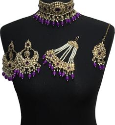 bridal jewellery set. Set includes- Necklace  Earrings  Jhumar  Tikka Chandbali Wedding Jewelry For Diwali, Wedding Chandbali Jewelry For Diwali, Festive Bollywood Purple Jewelry, Festive Purple Bollywood Jewelry, Purple Kundan Jewelry For Diwali, Purple Kundan Earrings For Wedding, Traditional Purple Kundan Necklace For Festive Occasions, Traditional Purple Kundan Necklace For Festivities, Elegant Purple Kundan Necklace For Festive Occasions