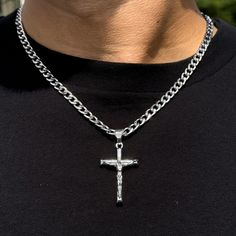 This elegant medium solid crucifix pendant is a timeless and versatile accessory that can be worn for any occasion. It is made of silver-plated alloy and comes with a 5mm Cuban chain or 4mm Rope chain. The pendant is approximately 1.5 inches wide and 2 inches long. Features: Chain Length - Cuban Chain- 22 inches - Rope Chaim- 20 inches - Material: Silver plated alloy - Dimensions: Approx. 1.5 inches width and 2 inches length - Includes: 5mm Cuban chain or 4mm Rope chain - A thoughtful gift for a Silver Crucifix Chain Jewelry, Silver Crucifix Figaro Chain Jewelry, Silver Crucifix Necklace With Figaro Chain, Silver Figaro Chain Necklace With Cross Pendant, Silver Cross Necklace With Figaro Chain As Gift, Silver Necklace With Figaro Chain And Cross Pendant, Silver Cross Necklace With Figaro Chain, Guys Fashion, Rope Necklace