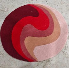 Bring an artistic touch to your space with this striking round rug. Featuring a dynamic swirl design, the rug showcases a blend of rich red, maroon, pink, and beige tones, creating a warm and inviting aesthetic. Its abstract design adds a modern and stylish vibe to any room. Ideal Placement: Living Room: Perfect for creating a bold centerpiece in your seating area. Bedroom: A cozy addition near the bed or under a vanity. Study or Lounge Area: Adds warmth and a contemporary feel. Creative Spaces: Ideal for a home studio or office to inspire creativity. Material & Care: Made with soft and durable material for comfort and longevity. Easy to maintain with regular vacuuming and spot cleaning. Available sizes:  4X6 5X8 6X9 8X10 9X12 10X14 Ft Antique Rug for Living Room, Kids room. Specializing i Swirl Rug, Bold Centerpieces, Red And Beige, Beige Tones, Creative Spaces, Lounge Area, Room Kids, Rug For Living Room, Modern Round