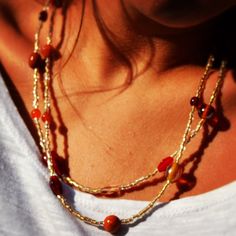 Double Strand Gold Orange and Red Necklace by uniquebeadingbyme, $25.00 Amber Beaded Czech Glass Necklaces, Amber Beaded Necklace With Czech Glass, Gold Double Strand Bohemian Beads, Bohemian Double Strand Beaded Necklaces With Gold Beads, Bohemian Double Strand Gold Beaded Necklaces, Bohemian Double Strand Gold Beads Necklace, Gold Long Necklace With Colorful Beads, Glass Necklaces With Tiny Beads For Jewelry Making, Gold Carnelian Beaded Necklaces In Bohemian Style