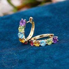 "❤Jewelry Details -Gold Type:  Solid 10K Gold / Solid 14K Gold / Solid 18K Gold (Choose One in Material Option) Stone Type: Natural Colored Gemstone (Red Tourmaline, Citrine, Blue Topaz, Peridot, Amethyst) Total Carat Weight: Approximately 3.0ct , 4.0mm*10pcs Color: 3A Clarity: VS Cut: Round Cut / 3EX Earrings Form Factor Size: 17*16mm SKU: YE0060 ❤The link for the same style ring is https://www.etsy.com/listing/1274158309/natural-colored-gemstone-ring-women?click_key=11c07786afd07133520572023a3bbb8601a786c9%3A1274158309&click_sum=69310cc3&ref=shop_home_active_20&pro=1&frs=1&sts=1 ❤The link for the same style pendant is https://www.etsy.com/listing/1260149690/round-cut-natural-colored-gemstone?click_key=17446ef01b4277e7f3d0363bad383bd417151a40%3A1260149690&click_sum=998eccd6&ref=shop_home_ Gemstone Hoop Earrings Fine Jewelry, Multicolor Jewelry With Prong Setting For Anniversary, Elegant Multi-stone Hoop Jewelry, Fine Jewelry Multi-stone Hoop Earrings For Anniversary, Yellow Gold Multi-stone Earrings In Cubic Zirconia, Yellow Gold Cubic Zirconia Multi-stone Earrings, Elegant Multi-stone Hoop Earrings, Multicolor Multi-stone Hoop Earrings For Anniversary, Anniversary Multicolor Multi-stone Hoop Earrings