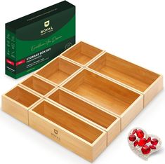 a wooden box with six compartments and a heart shaped broochet on the side