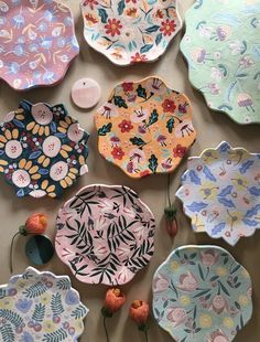 colorful plates and flowers are laid out on the table