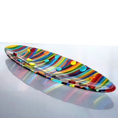 "Fused glass unique rainbow oval platter, made in Israel.  Size:( 17x47 cm) 6.69\" x 18.5\" 🌈 Welcome to my vibrant world of fused glass art! 🌈 Add a touch of color and elegance to your dining table, coffee table, or home decor with my Fused Glass Unique Rainbow Oval Platter. A colorful platter could feature a range of hues, from bold and bright to more subtle and pastel shades. The colors may be arranged in a pattern or design, or they may be more abstract and organic in their placement. Each Abstract Fused Glass Ideas, Fusing Glass Art, Fused Glass Plates Serving Platters, Fused Glass Rainbow Ideas, Glass Fusion Plates, Fused Glass Platters, Fused Glass Patterns Free, Fused Glass Tray, Fused Glass Bowls Ideas