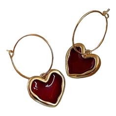 Add a touch of elegance and sophistication to your outfit with these stunning gold with red resin hoop earrings. Measuring at a delicate 1.5" x 1", these thin gold hoops are exquisitely designed with a vibrant red resin heart charm, creating a beautiful contrast. Whether you're attending a formal event or looking to elevate your everyday look, these earrings are the perfect choice. Made with attention to detail and featuring a secure closure, these earrings will add a pop of color and style to a Resin Hoop Earrings, Earrings Red, Gold Hoops, Pretty Jewellery, Gold Hoop, Gold Hoop Earrings, Vibrant Red, Heart Charm, Red Gold