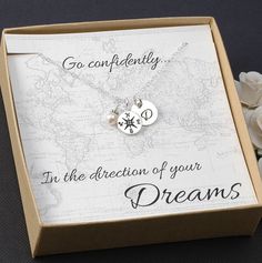 a box with a necklace in it that says go confidently in the direction of your dreams